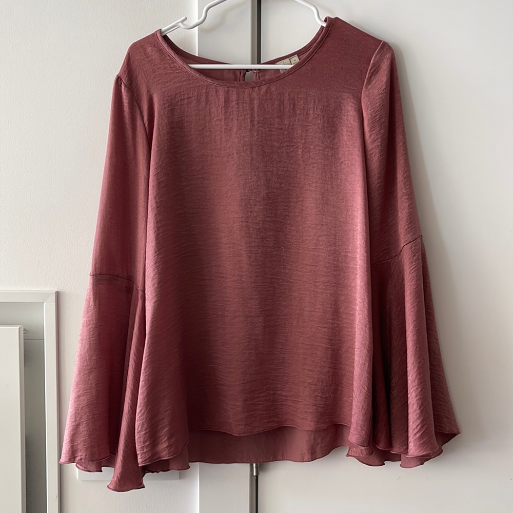 Woman’s Pink Bell Sleeved Top